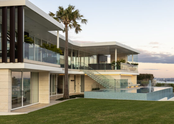 Jura Beige Ripple stone cladding on a house with an infinity pool.